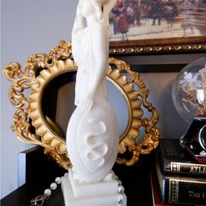 Goddess Athena alabaster statue with weapon and shield.